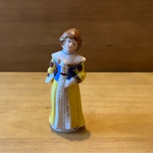 Victorian-style woman figurine